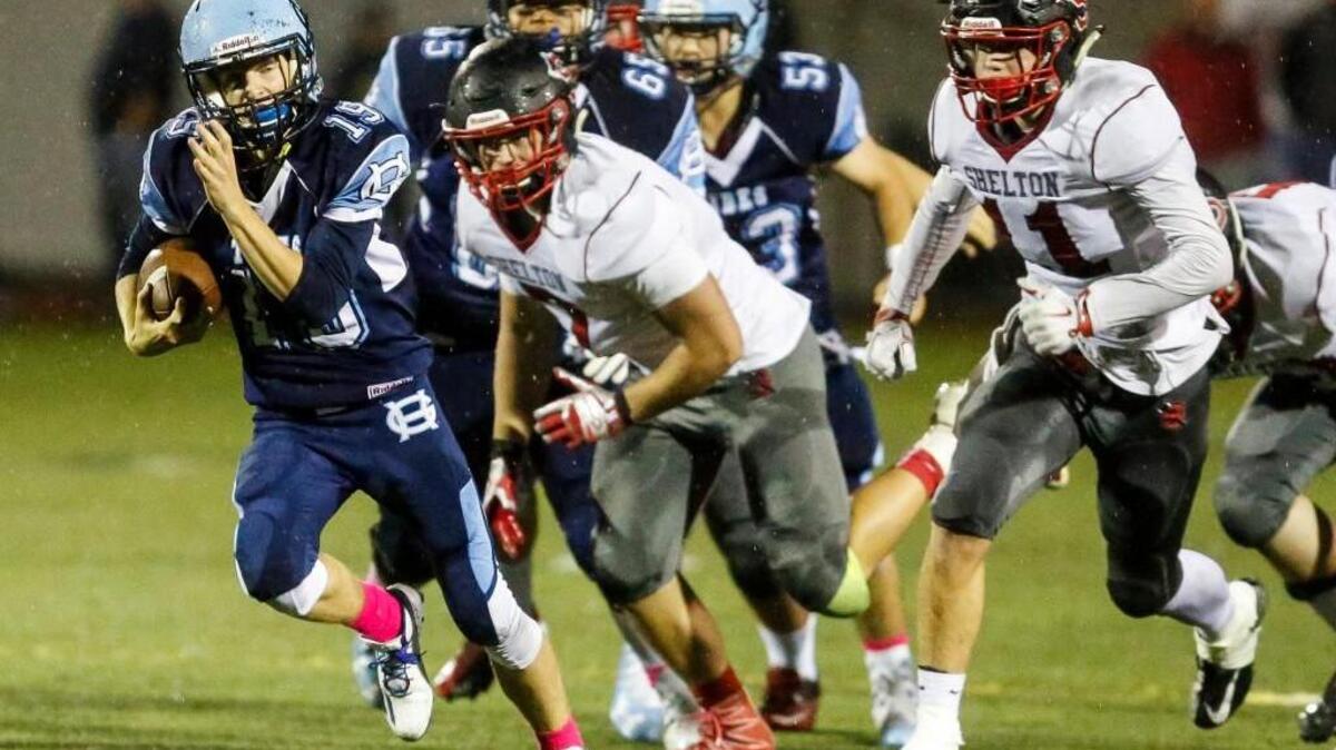 Gig Harbor’s Ben Hollenbeck (19) breaks away for a touchdown run in the fourth quarter against Shelton last week. Hollenbeck has been electric for Gig Harbor in the running game in his three games as the starter.