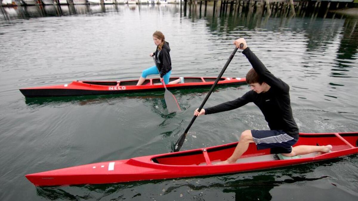 Gig Harbor Canoe and Kayak Racing Team members Kenny Kasperbauer and Makenzie Sousely paddle into Gig Harbor Bay during team practice last year. The team is looking to win its fifth consecutive national title in Oklahoma City this week.