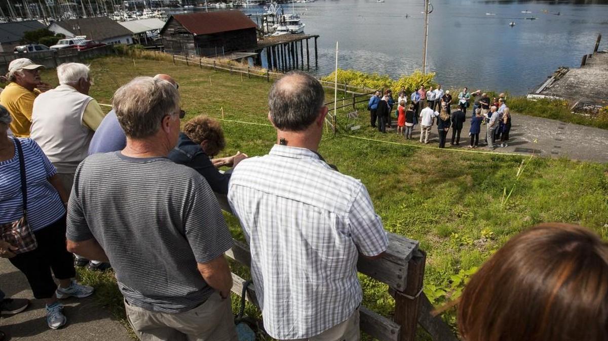 People watch as Gig Harbor City Council members view a staked out design of the proposed building at Ancich Park in July 2016. One of the park’s main tenants will be the Gig Harbor Canoe and Kayak Race Team.