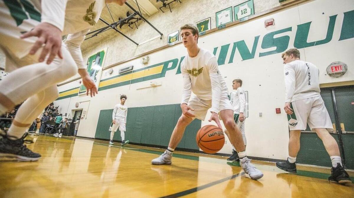 Peninsula guard Seth Kasteler warming up before a game against Timberline.