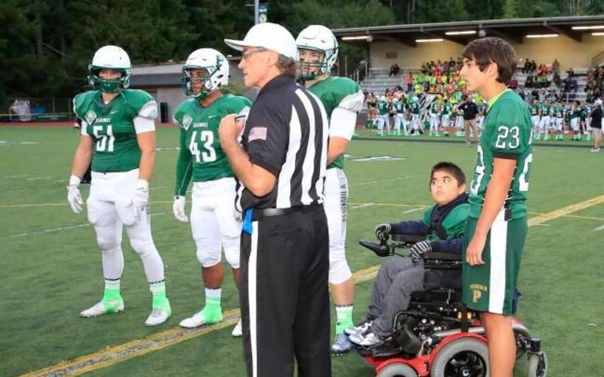 
Harbor Ridge Middle School seventh-grader Micah Hester, who has Duchenne Muscular Dystrophy, was an honorary captain at Peninsula’s game on Friday against Auburn.
