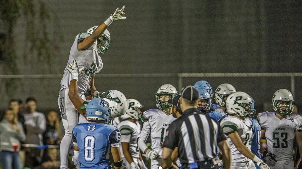 Peninsula running back Braeden Potter (30) celebrates a touchdown in the 39th Fish Bowl against Gig Harbor on Friday night.