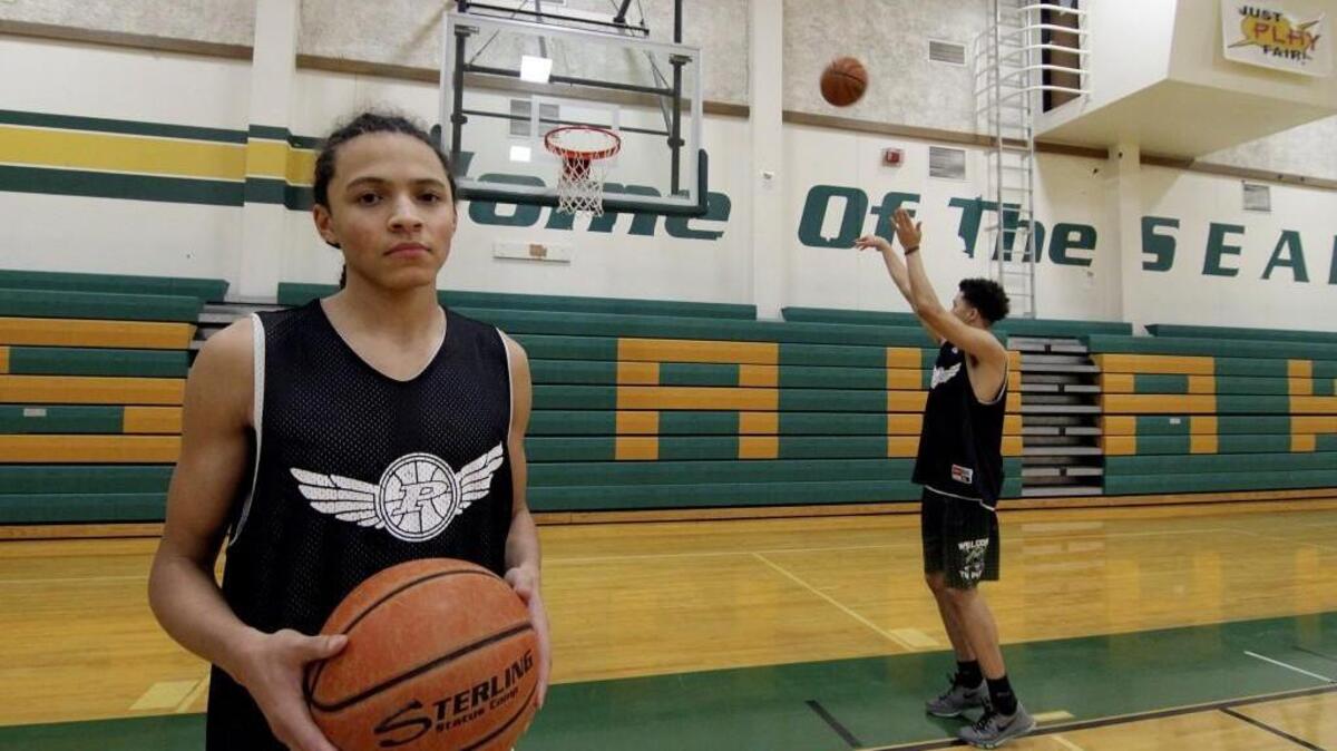 Peninsula High School sophomore Elijah McLaughlin has earned more playing time for the Seahawks this season and has become a solid contributor while playing alongside his brother, senior star JaQuori McLaughlin, right.