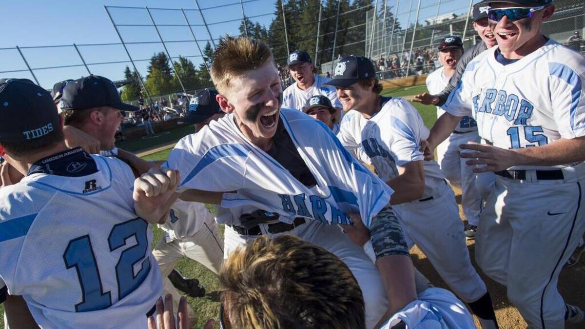 Gig Harbor High players celebrate after overcoming an eight-run deficit to beat Lakeside 10-9 at Curtis High School in University Place on Saturday, May 20.