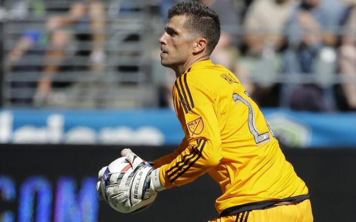 
Orlando City goalkeeper Tally Hall, a 2003 Gig Harbor High School grad, holds the ball in the second half of an MLS soccer match on Sunday against the Sounders. 
