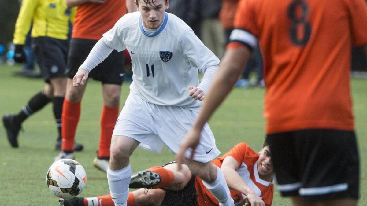 Gig Harbor’s Shawn Kimble (11) moves the ball up the field in the first half. Gig Harbor played Central Kitsap in a soccer match at Gig Harbor High School in Gig Harbor, Wash., on Thursday, April 13, 2017.