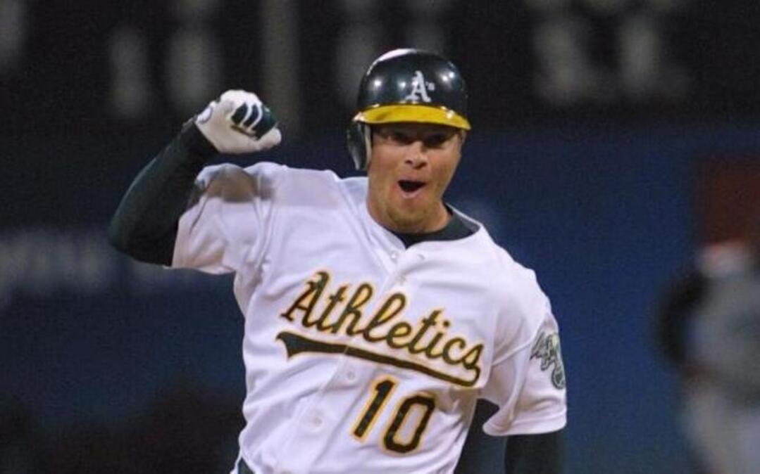 Oakland Athletics' Scott Hatteberg celebrates his home run in the bottom of the ninth inning against the Kansas City Royals, for Oakland's 20th consective victory and a new American League record, Wednesday, Sept. 4, 2002, in Oakland, Calif. The A's won 12-11.