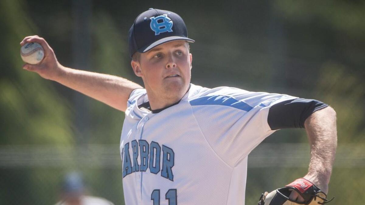Gig Harbor’s Avery Jones pitches in the seventh inning against Bainbridge at Curtis High School.