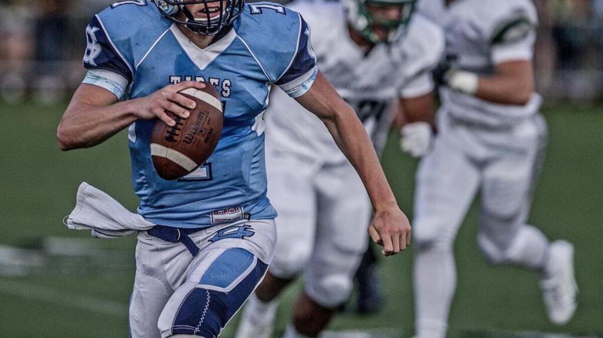 Gig Harbor's Davis Alexander (7) scrambles for a few yards early in the first half of the Fish Bowl at Roy Anderson Field in Purdy in September. Next year’s Fish Bowl could be a league contest between Gig Harbor and Peninsula if the Tides were to move into the South Puget Sound 3A league.