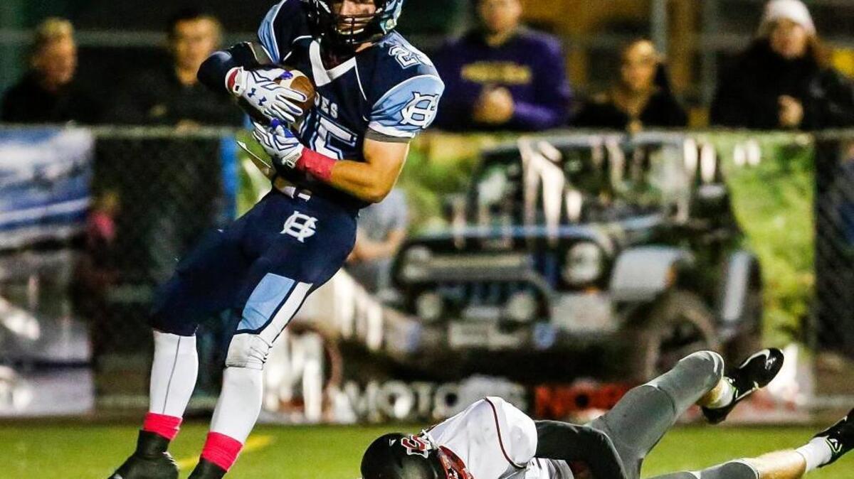 Gig Harbor’s Marc Fletcher (25) catches a touchdown pass in the second quarter from quarterback Ben Hollenbeck.