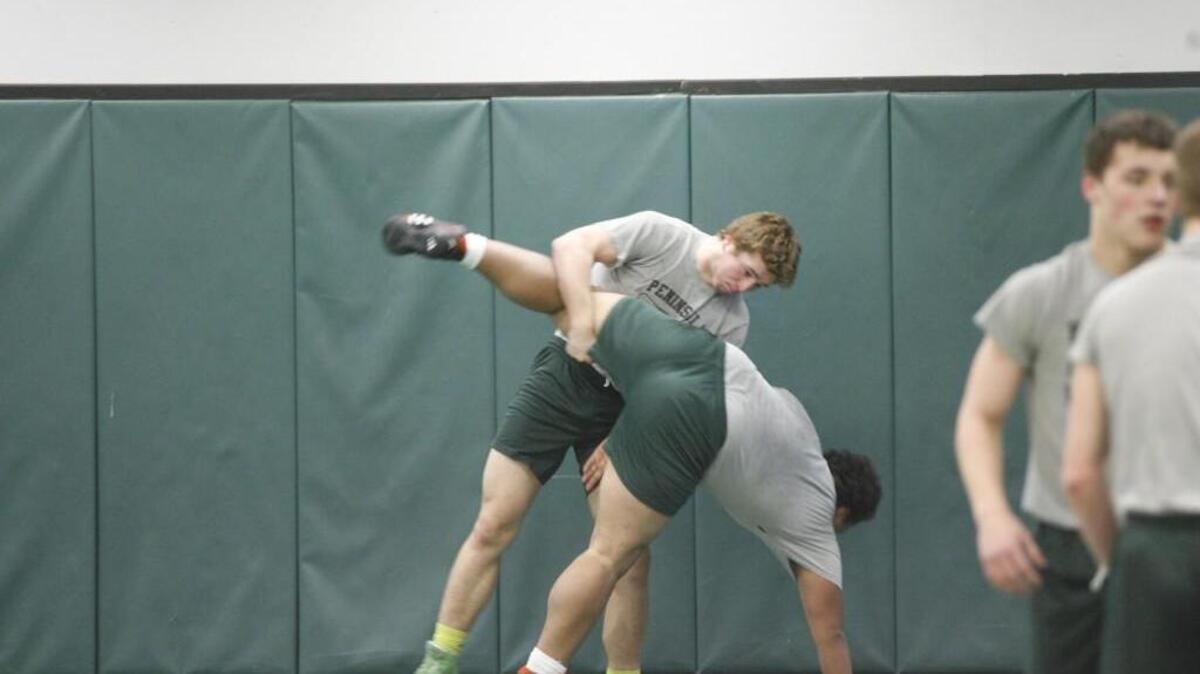 Peninsula senior Chance Stolz, left, is one of the state’s top-ranked wrestlers in the 195-pound class.