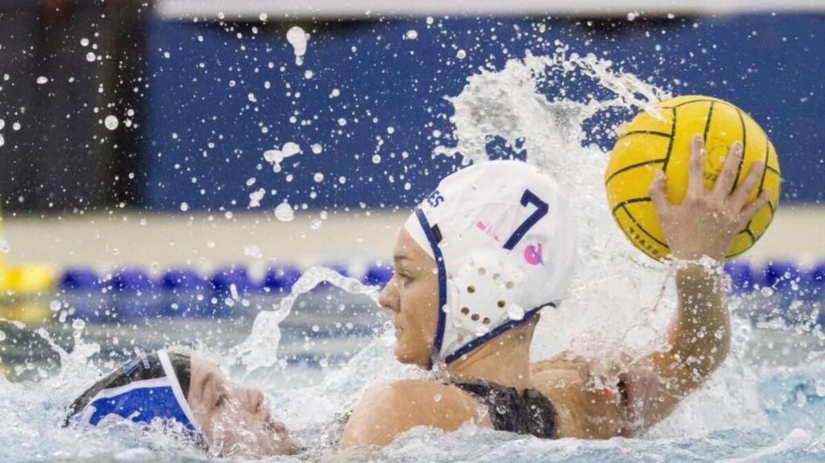 Gig Harbor’s Kenzie Bailey pulls up to shoot during the girls high school water polo state championship game Saturday against Curtis at Curtis High School.
