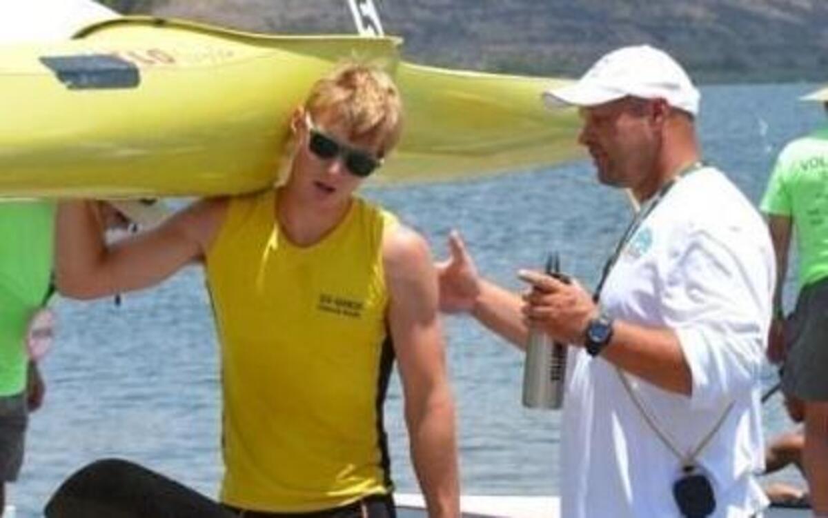 Athlete Kyle Field talks with GHCKRT high-performance coach Holm Schmidt during 2015 nationals in San Diego. Schmidt recently parted ways with the club.