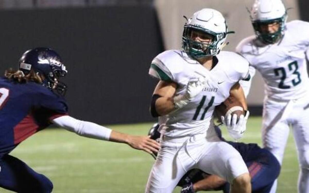 Peninsula’s Evan Johnson breaks out on a kickoff return for the Seahawks. Peninsula beat Mt. Spokane, 22-0.