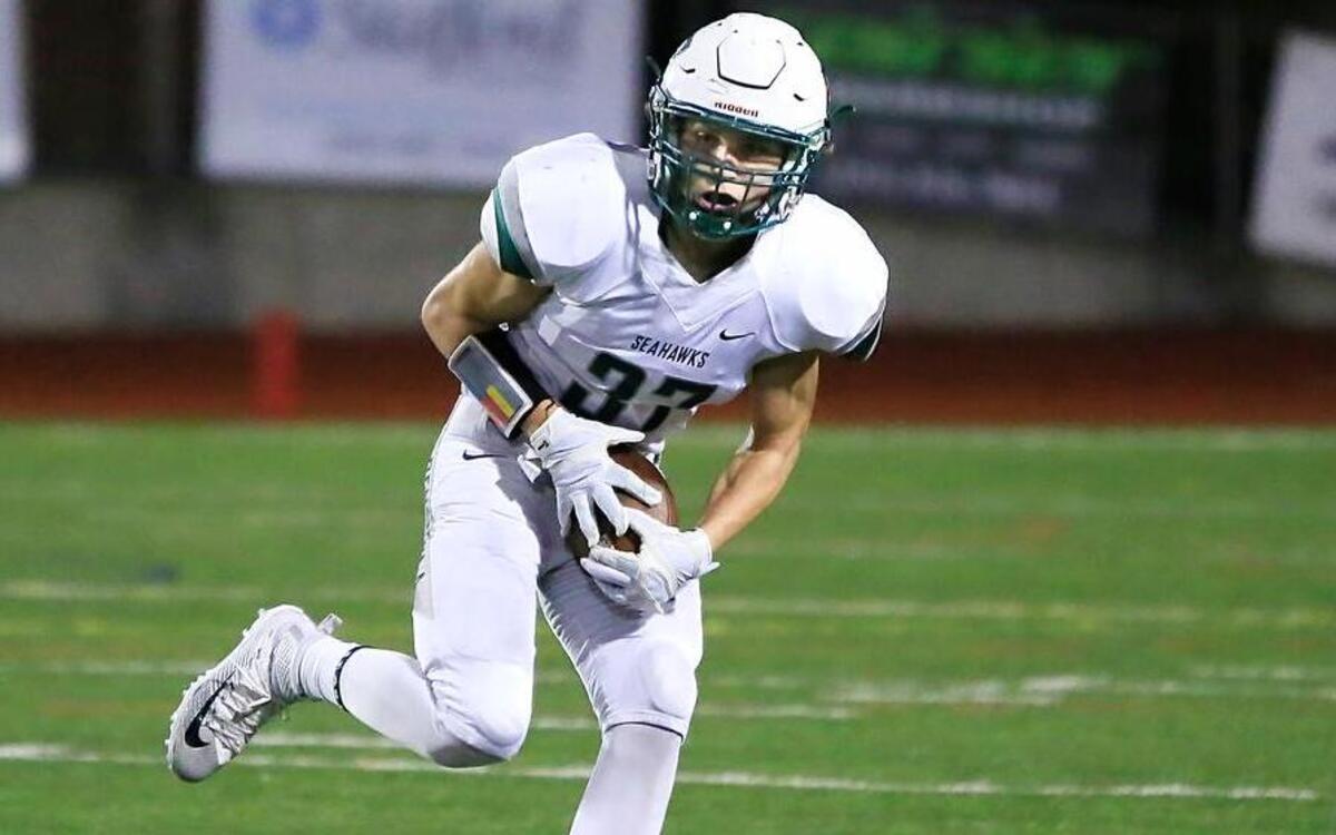 Peninsula High running back Blake Cantu carries the ball against Bonney Lake on Friday night.