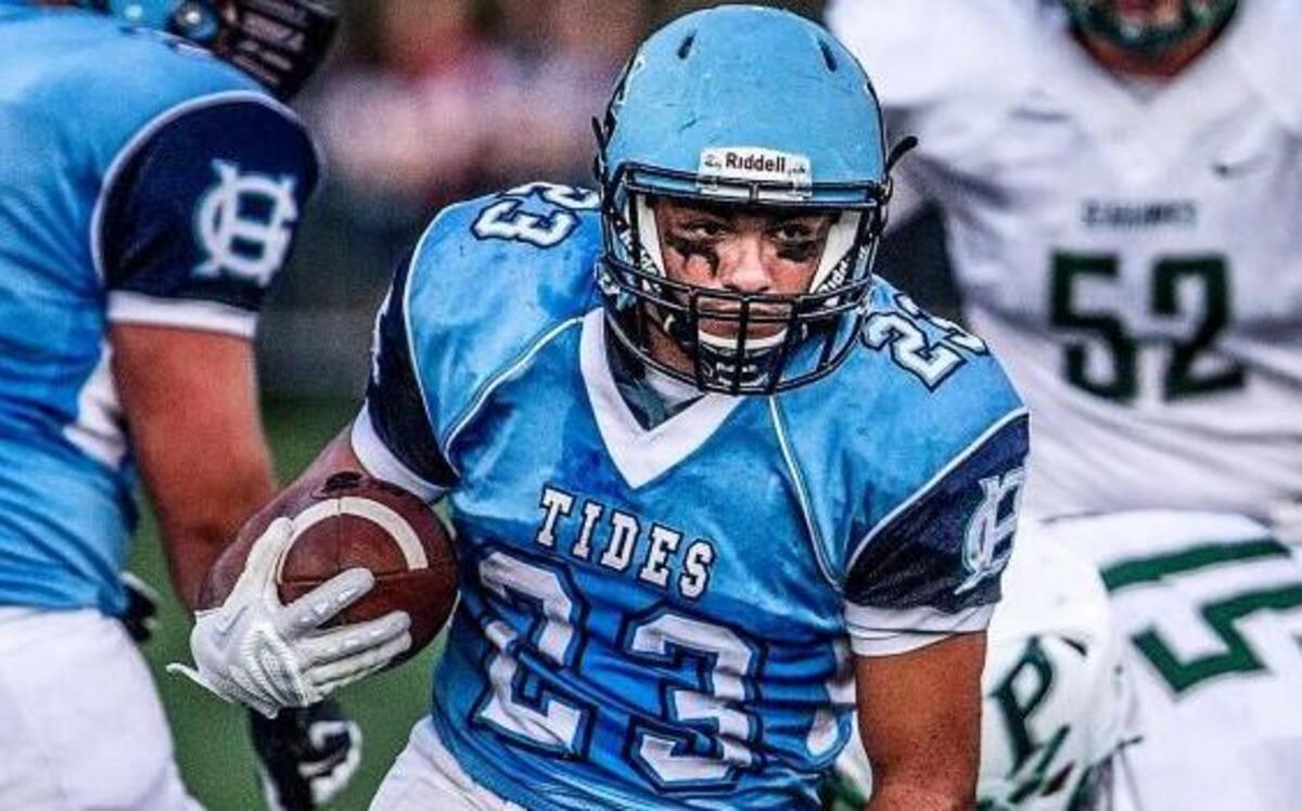 
Gig Harbor's Adrian Valona runs for a touchdown in the first half of the 37th edition of the Fishbowl at Roy Anderson Field in Purdy on Friday. The Tides won, 40-14. 
