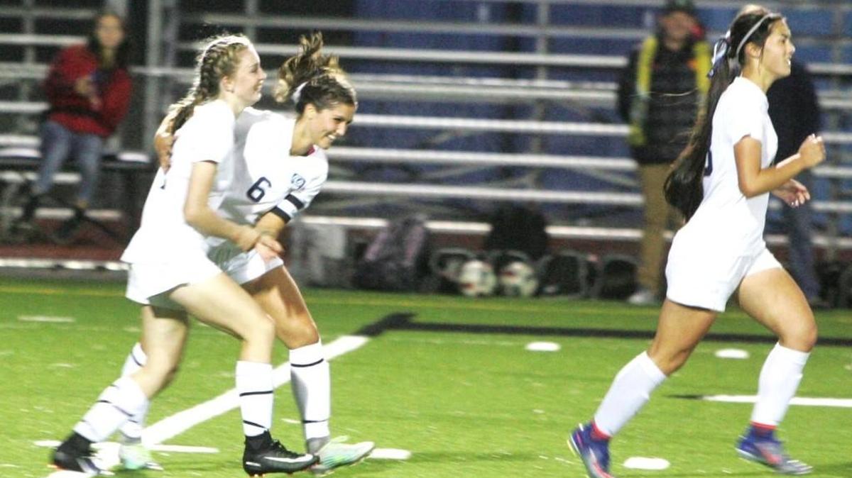 Gig Harbor’s Alyssa Gray (14) celebrates with teammate Sophia Hatteberg (6) after scoring the game’s lone goal late in the first half on Sept. 19 at Roy Anderson Field. Gig Harbor won, 1-0.