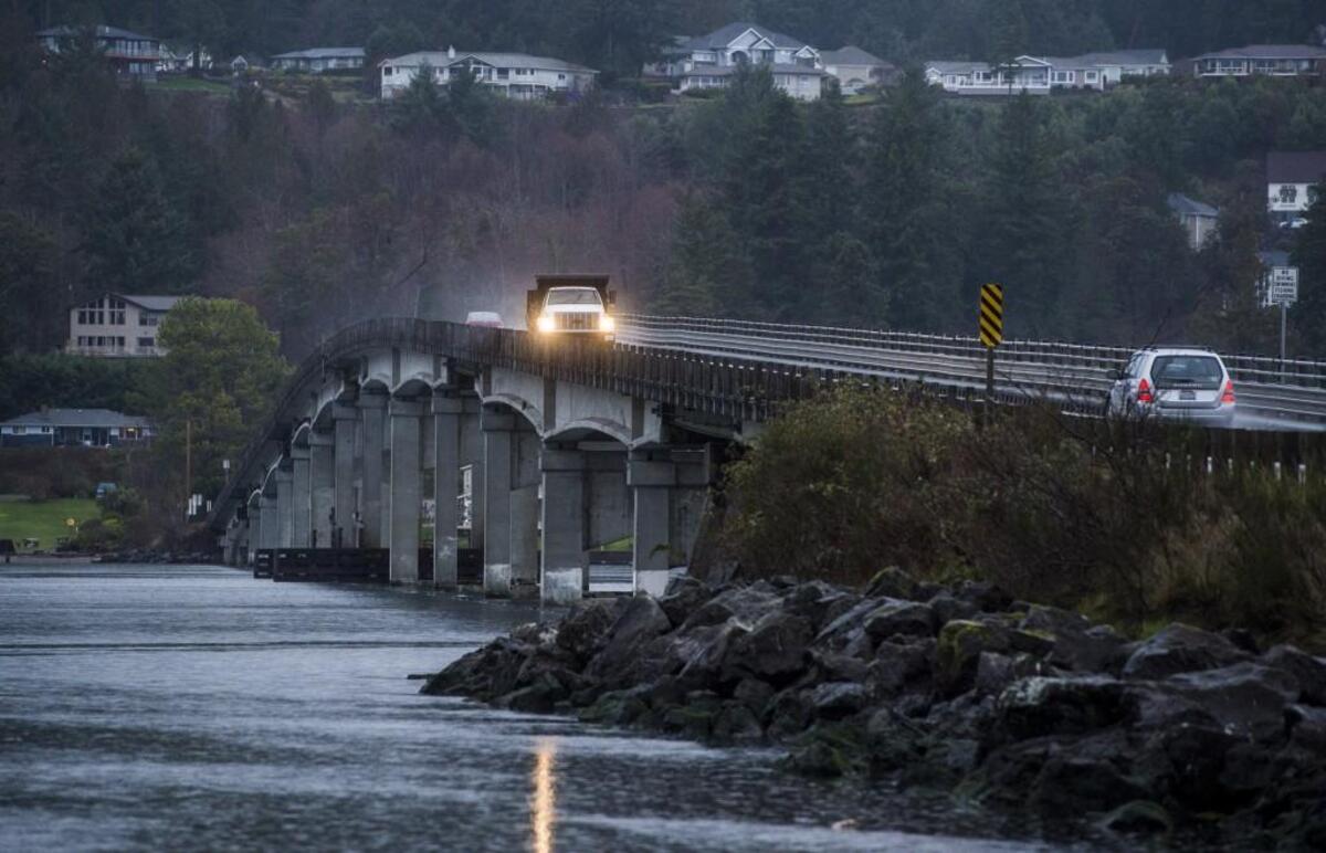 Cars drive along the bridge connecting Gig Harbor and Fox Island. The bridge is the only way to and from the island.