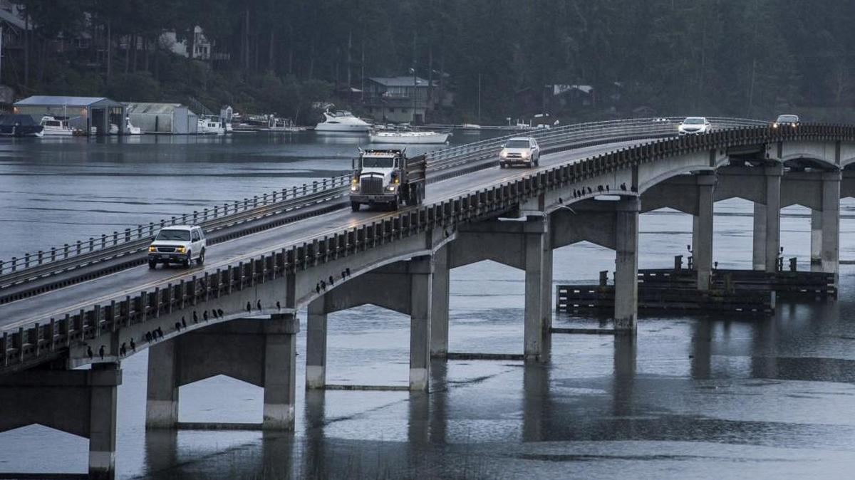 Cars drive along the bridge connecting Gig Harbor and Fox Island. The bridge is the only way to and from the island.