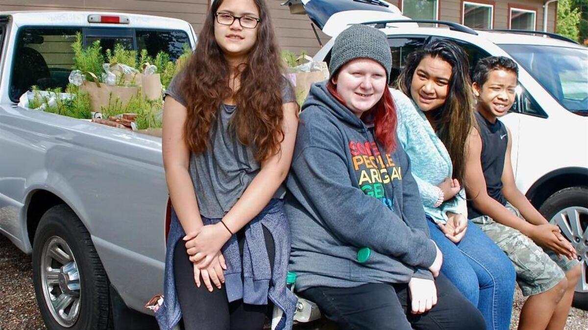 Four Harbor Ridge Middle School students volunteered April 23 to help sort tree seedlings for the Gig Harbor Peninsula Arbor Day Organization. From left, Kiara Dominguez, Abby Haffly, Onaly Techur and Albert Jackson.