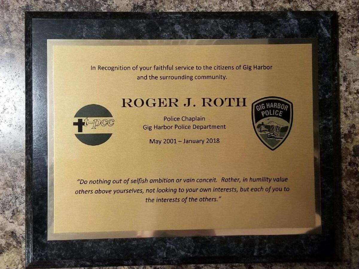 A plague presented to Roger Roth from the City of Gig Harbor for his role in the past 17 years as police chaplain.