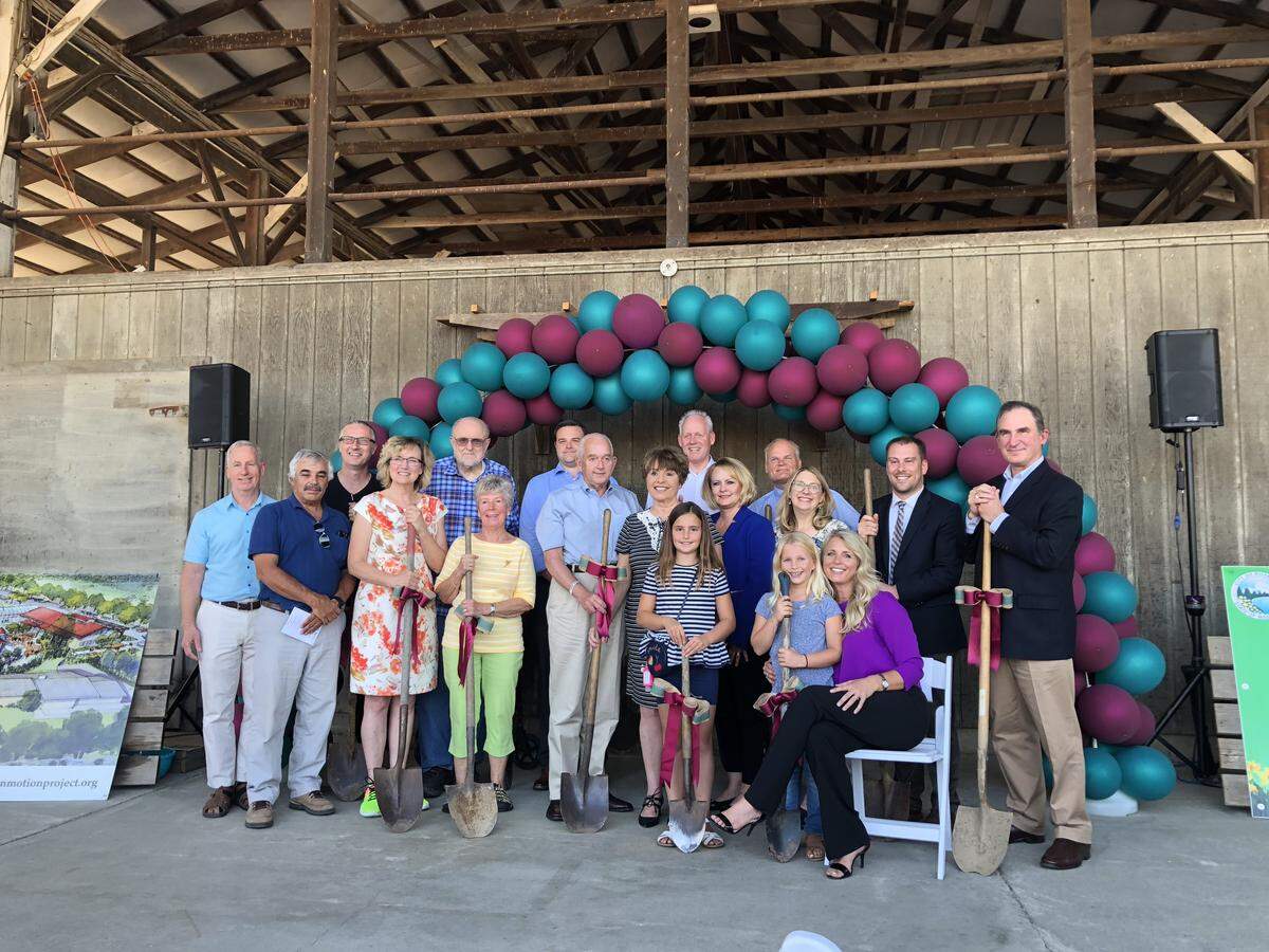 City staff, donors and representatives of nonprofit Step By Step celebrate the groundbreaking of the Germaine Korum Center for Women and Children and Van Lierop Park, which will be built side-by-side in Puyallup.
