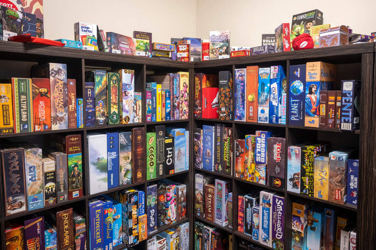 Jan and Chad Martinell have been board game aficionados for decades. They use one of the two vaults in their recently renovated bank for board-game enthusiasts to borrow their games and play them in the store for $5. The Martinell’s have several hundred games available for anyone to try out.