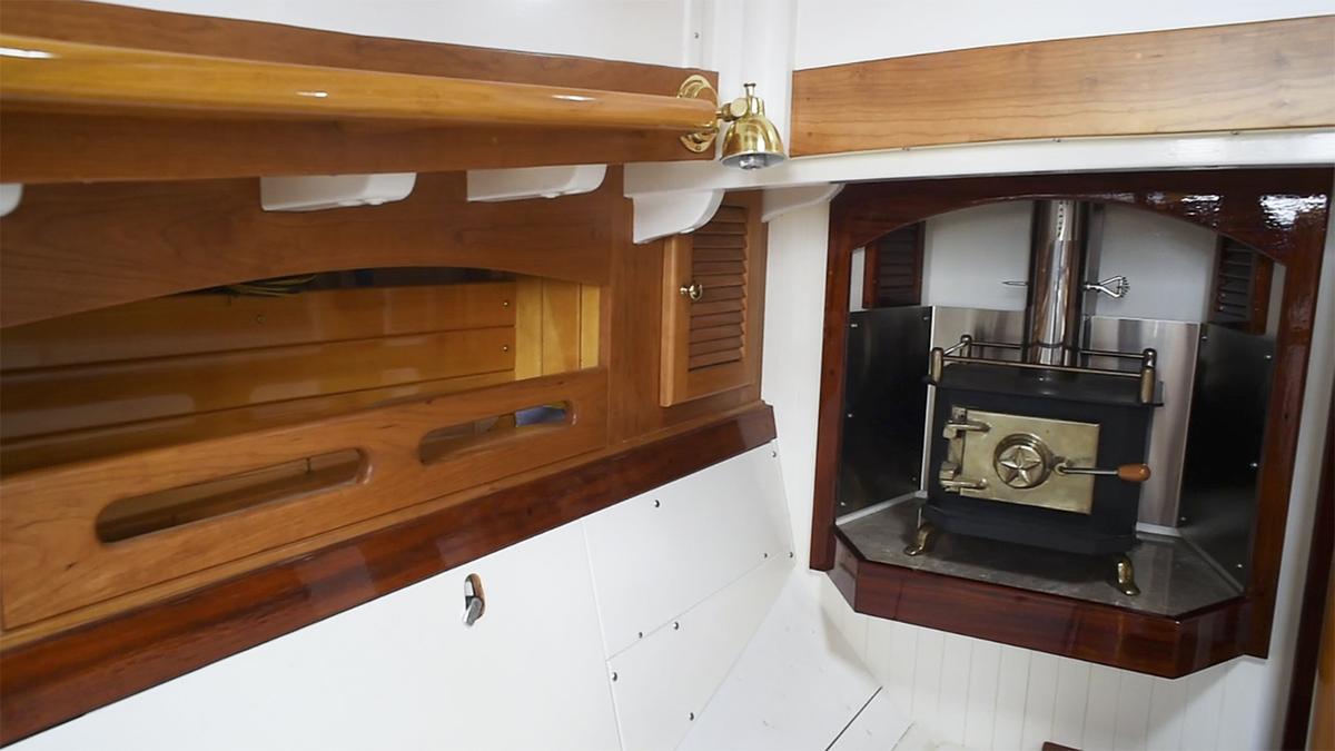 In America’s cabin, Tom Crout installed all the basics: a sink, stove, bathroom, refrigerator, storage space and a handmade furnace.