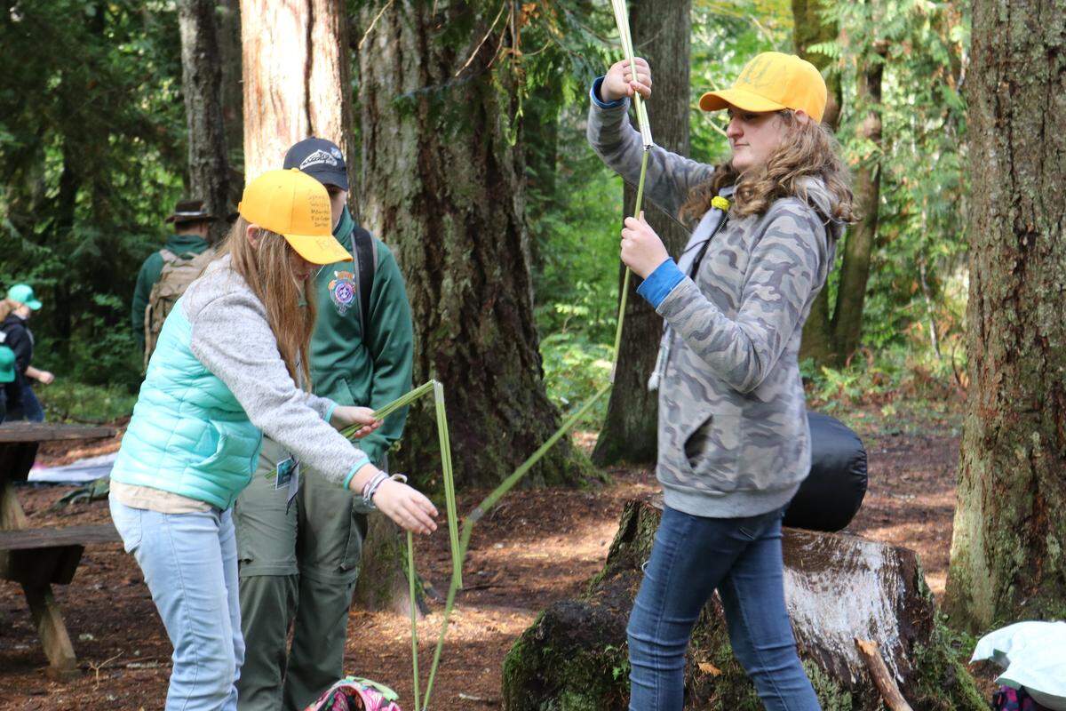 Scouts-to-be learn the art of setting up a tent at the first ever BSA Boot Camp for Girls at Camp Thunderbird in Olympia. Oct. 6, 2018