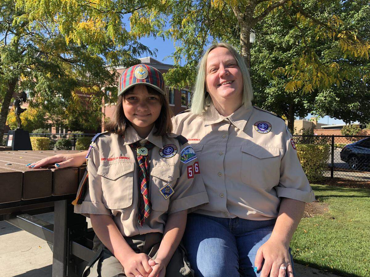 Bronwyn Khan, 10, and her mother, CoreyAnn Khan, sit together on a bench at Puyallup’s Pioneer Park. Bronwyn is one of the first girls to join Boy Scouts of American through the organization’s Early Adopter program.