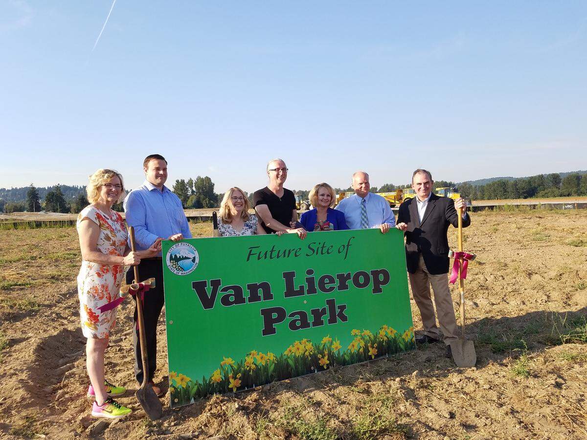 Puyallup Councilwoman Robin Farris (left), Deputy Mayor Tom Swanson , Councilwoman Cynthia Jacobsen, Councilman Dean Johnson, Councilwoman Julie Door, Mayor John Palmer and Councilman Jim Kastama celebrate the official groundbreaking of Van Lierop Park on Aug. 28, 2018.