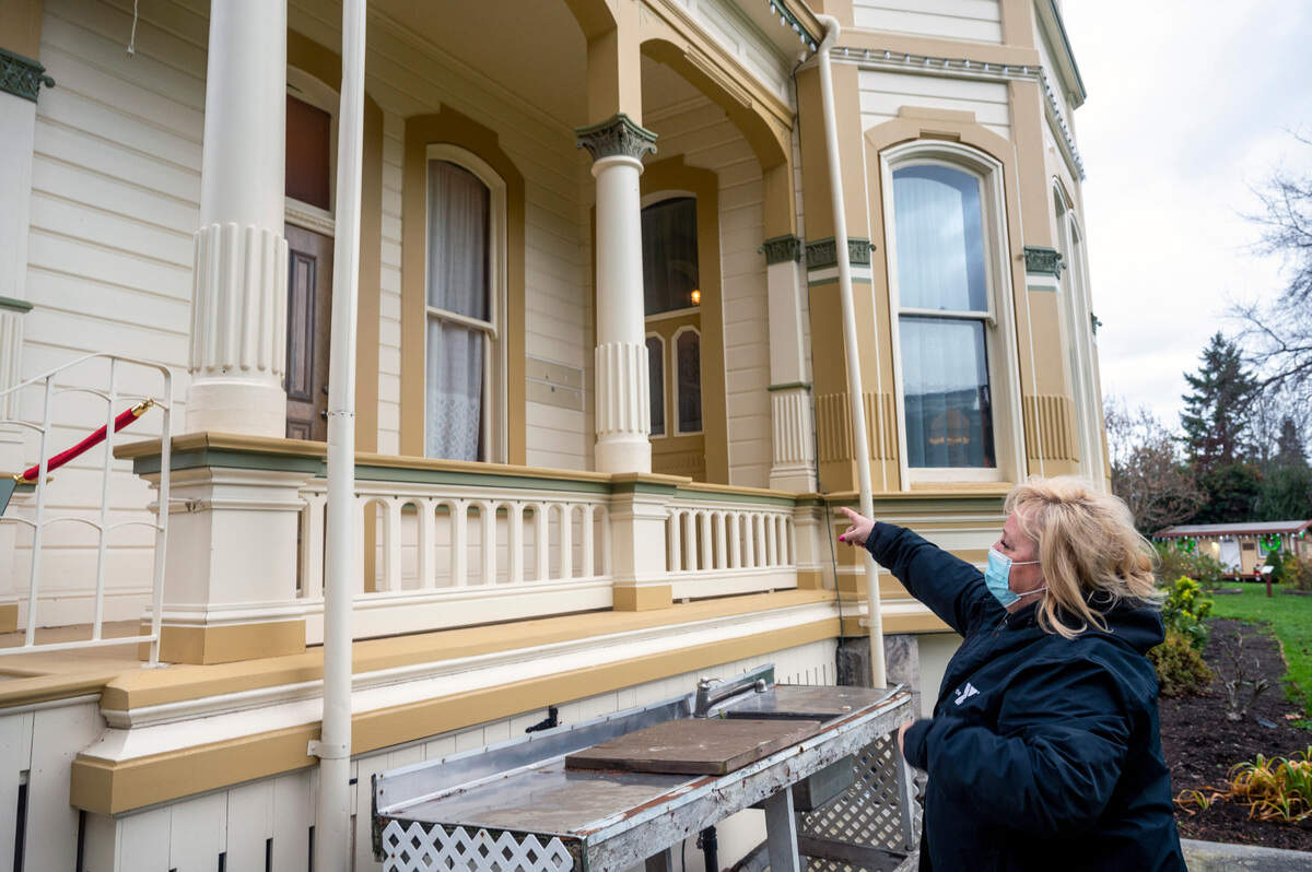 Shelly Schlumpf, the president of the Puyallup Historical Society at Meeker Mansion, points to where there has been multiple incidents of vandalism at the Meeker Mansion. The incidents have been occurring for a few years now and they plan on building a fence surrounding the property to mitigate the problem.