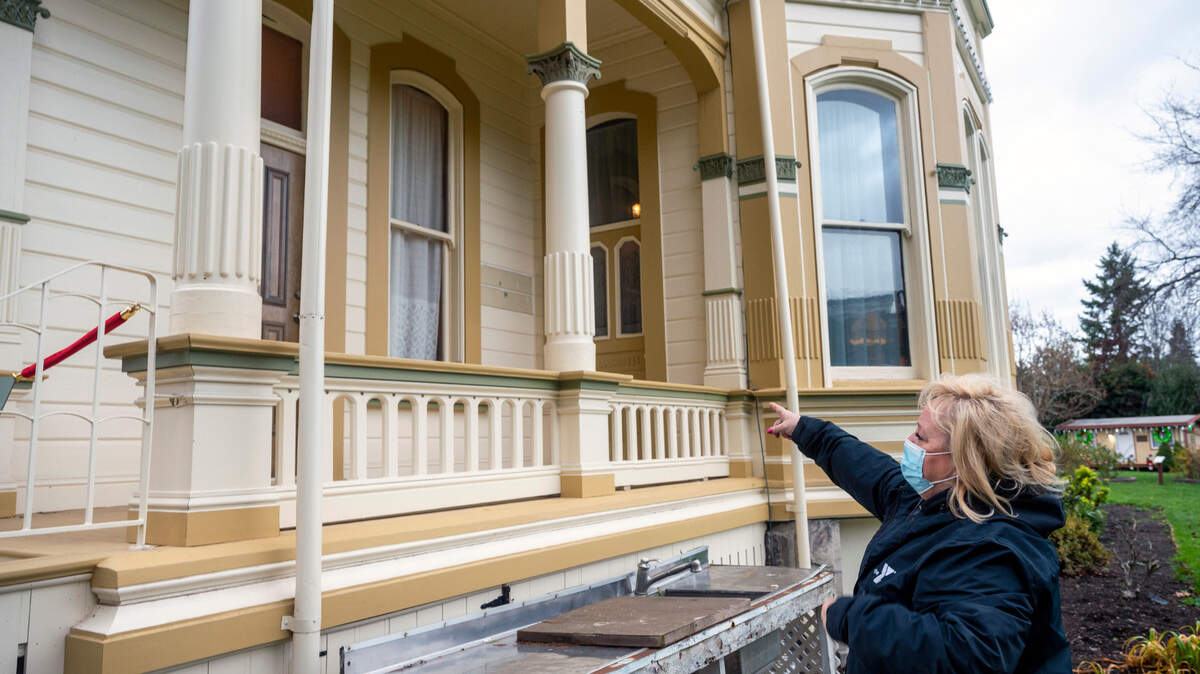 Shelly Schlumpf, the president of the Puyallup Historical Society at Meeker Mansion, points to where there has been multiple incidents of vandalism at the Meeker Mansion. The incidents have been occurring for a few years now and they plan on building a fence surrounding the property to mitigate the problem.