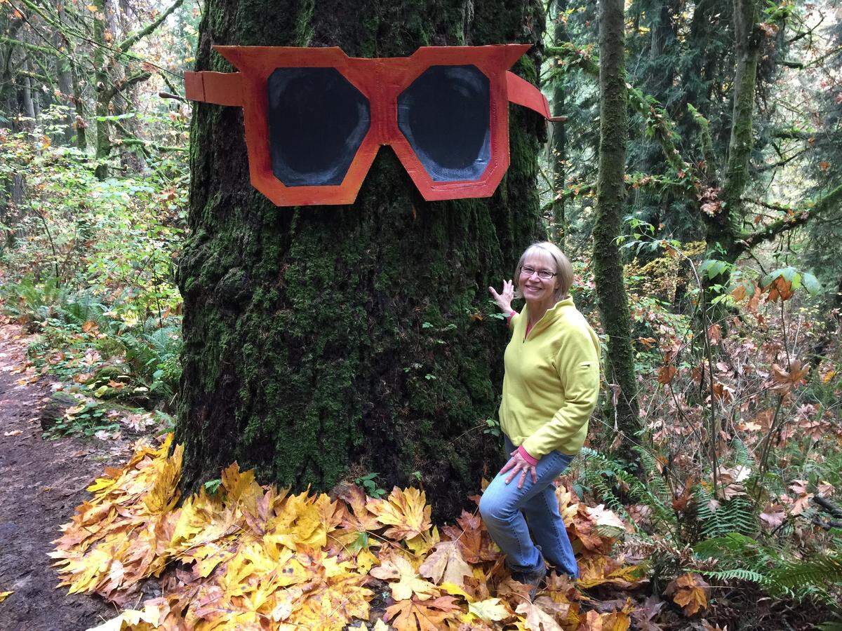 Rae McDonald stands beside a Douglas fir tree she named Granny. The tree is the inspiration for her second children's book, "Gran, Gran, Granny," publishing in May.
