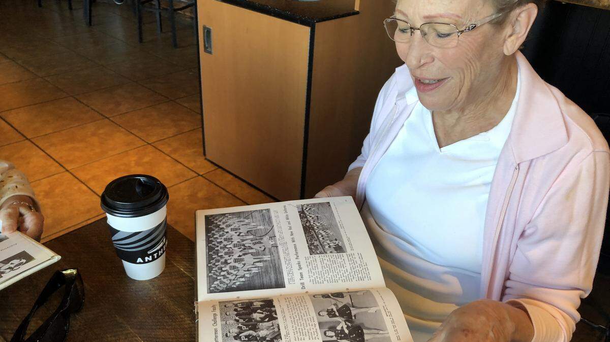 Kareen Shanks, Puyallup High School Class of 1962, rifles through an old PHS yearbook. PHS graduates between 1960-1963 were notified to participate in a follow-up survey for Project Talent, a survey they took nearly 60 years ago.