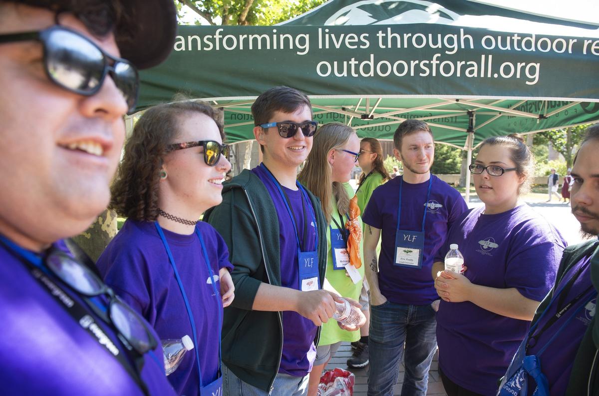 Program graduate Blake Nelson of Graham (third from left) chats with fellow counselors during the Youth Leadership Forum at The Evergreen State College in Olympia on Wednesday, July 25, 2018.