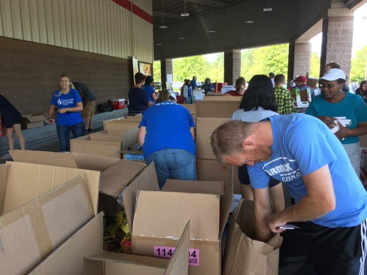 Volunteers for the Fill the Canoe School Supply Drive organize thousands of dollars worth of school supplies to be given to students in need in the Puyallup School District.