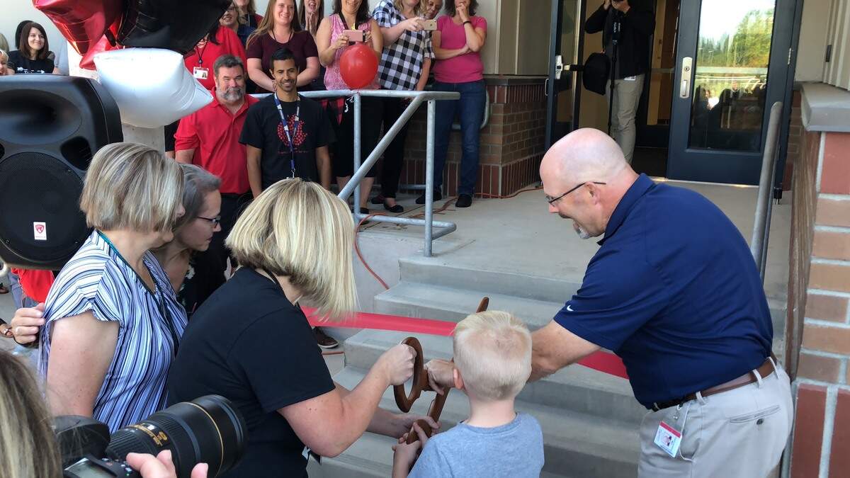 Teachers and students gather to celebrate the ribbon cutting of a new 12-classroom addition at Hunt Elementary that’s expected to help ease the influx of students. Sept. 4, 2018
