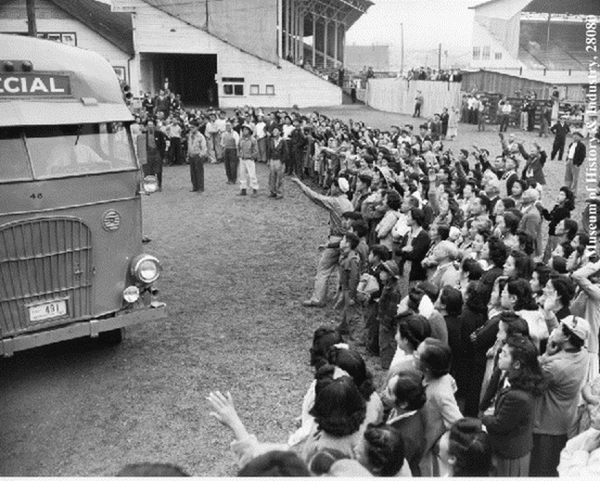 Japanese residents of the Puyallup Assembly Center at the Puyallup fairgrounds register for housing shortly upon arrival in 1942.