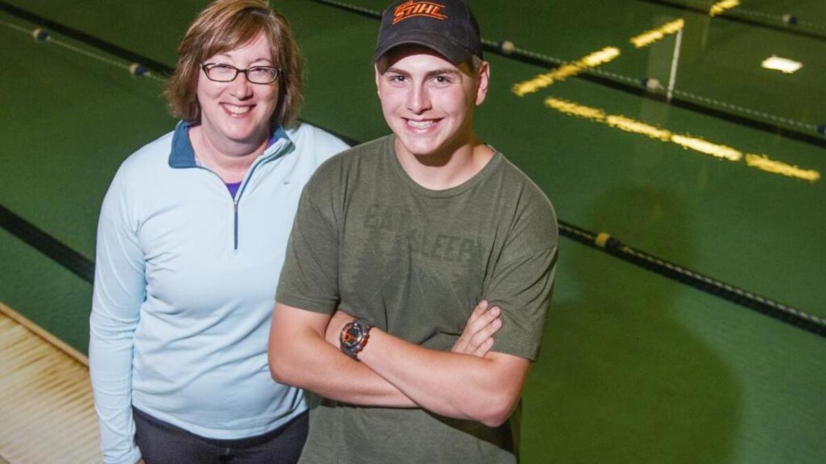Physical education teacher Lisa Muiznieks, left, and Puyallup High School student Logan Tarrant, right, saved the life of a drowning student in early May. Tarrant, Muiznieks, Jennifer Nicholson and Marc Wiese will be recognized at the Puyallup School Board meeting June 6.