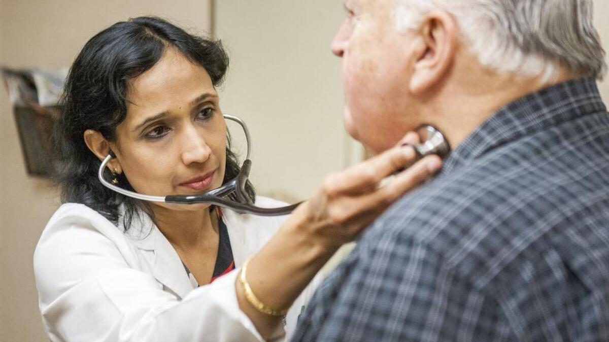 Dr. Uma Krishnan checks up on her patient, Larry Zehnder, at the Cardiac Study Center last week in Puyallup. The Cardiac Study Center and MultiCare are partnering to create a new cardiovascular institute called Pulse Heart Institute.