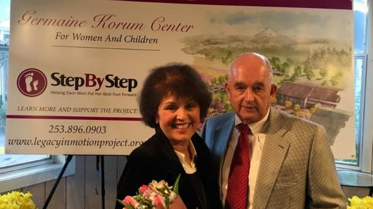 Germaine and Jerry Korum stand together at the ribbon cutting of the Germaine Korum Center for Women and Children.