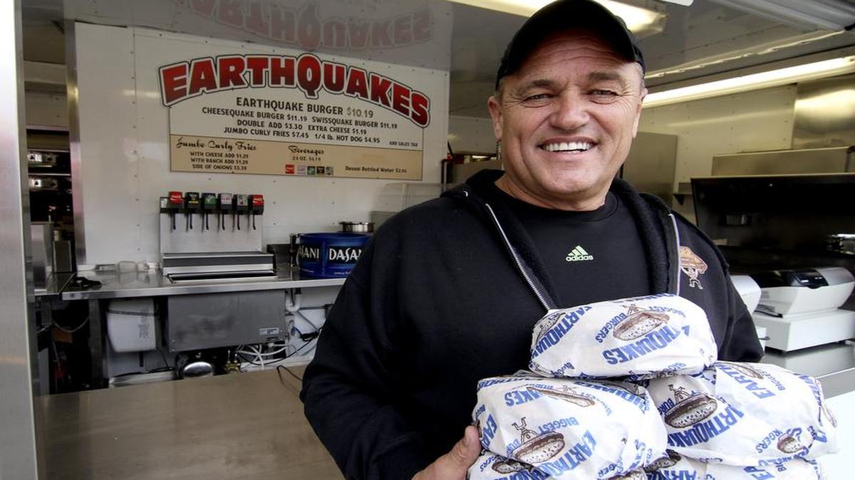 
Larry Ball, owner of Earthquakes Burgers, is excited about his 23rd year of serving the monster-sized burgers and fries at the Washington State Fair. 
