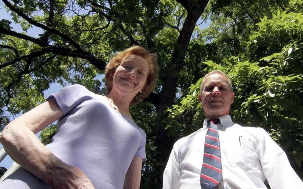 
Siblings Wendy and John Leavitt stand in front of the century-old butternut walnut tree next to Sparks Stadium in Puyallup. The pair hope to save the tree from an expansion to the athletic complex. 
