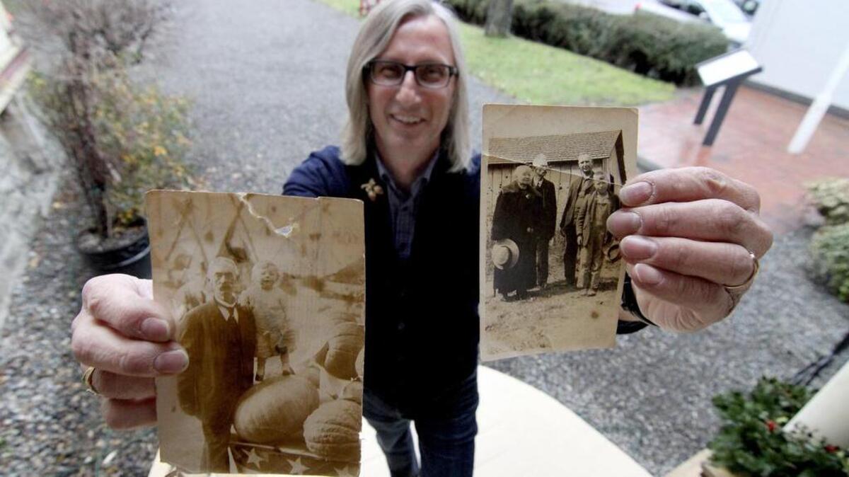 Puyallup Councilman-Elect Dean Johnson is carrying on the sixth-generation residency of his family and the distinction of being the second family member to serve on the city’s council. Johnson holds two photos of his great-great grandfather, Perry Summerfield, who was on the first legal city council starting in 1891.