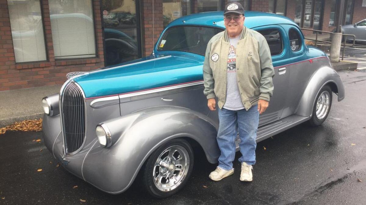 King’s Men Car Club president Ken Bradford stands next to his 1938 Plymouth Business Coupe. Bradford says club members pride themselves on the fact they drive — not trailer —their hot rods to the shows and events they attend throughout the Pacific Northwest.