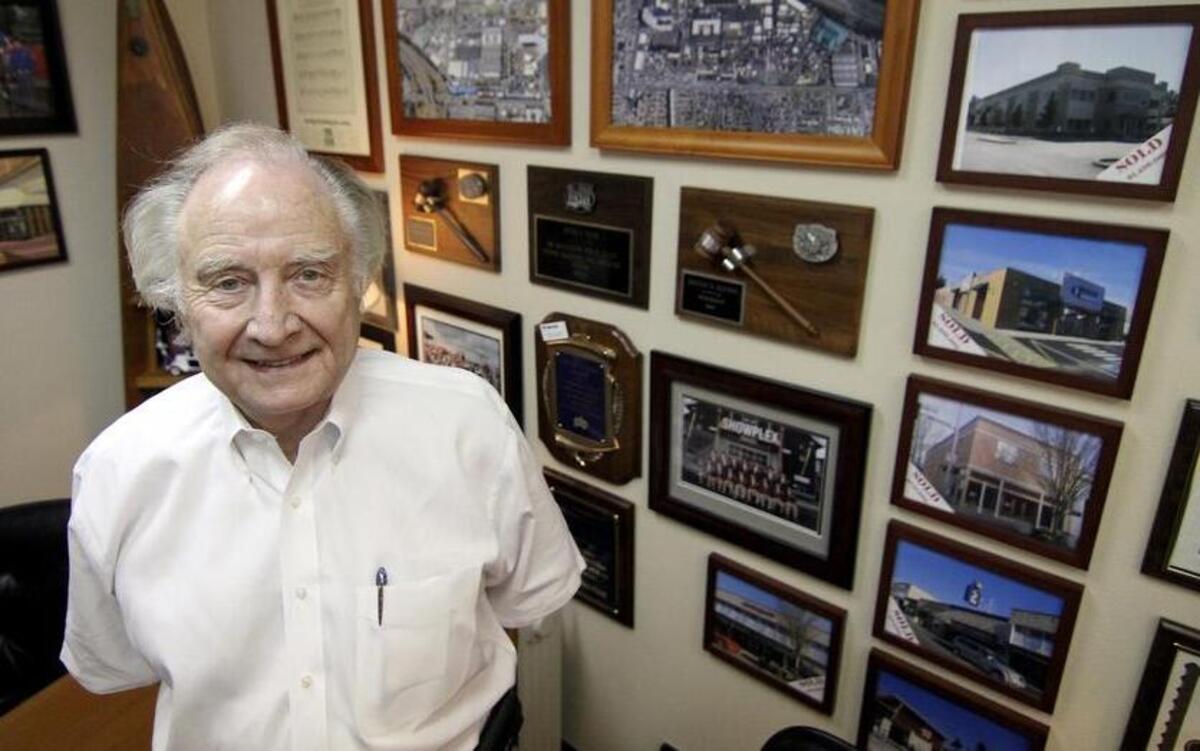 
Denny Elvins, a third-generation Washington State Fair board member, stands in his Puyallup office last week surrounded by career- and fair-related photos and keepsakes. 
