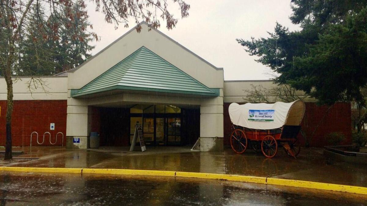The South Hill Library recently celebrated its 25th anniversary of being in its current location at 15420 Meridian Ave. E. by inviting the South Hill Historical Society to park its covered wagon outside the front entrance.