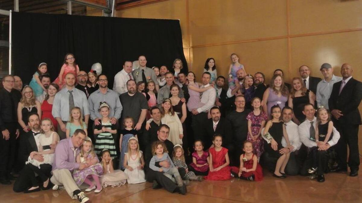 A group of dads and their daughters gather for a photo at the Puyallup Parks and Rec’s annual Daddy Daughter Dance at the Pavillion at Pioneer Park. The popular event is expected to sell out in its 11th year of the event.