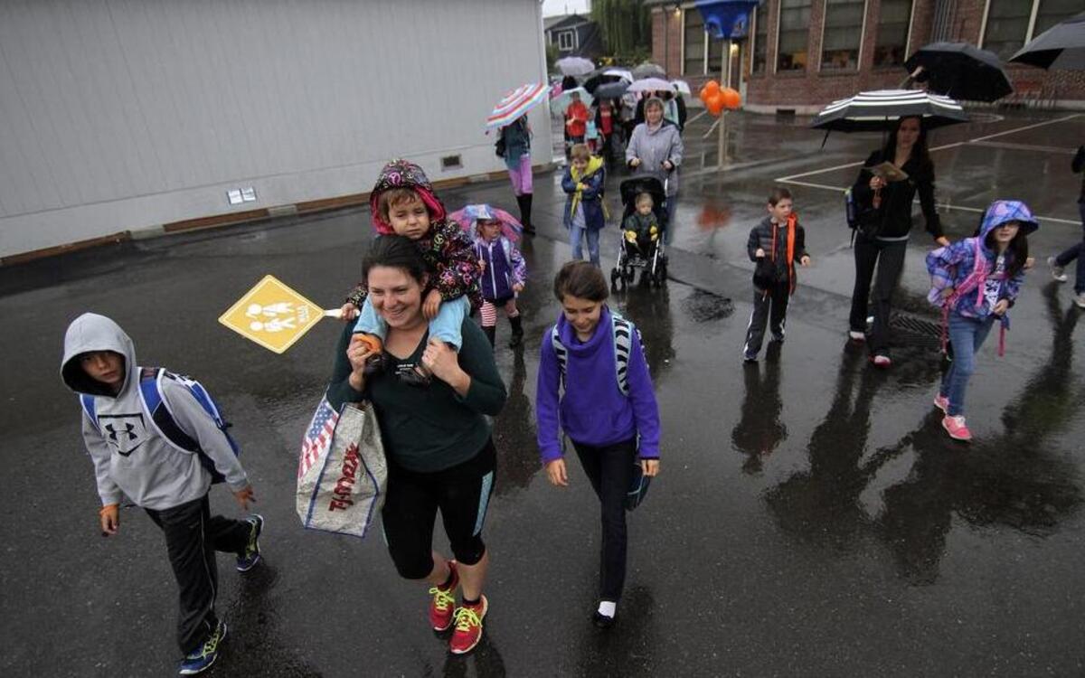 
Meeker Elementary School students, parents, teachers and area military volunteers walk to the Puyallup school Oct. 7 in support of grants to provide crosswalks and healthy lifestyles. The walk was part of National Walk to School Day activities.

